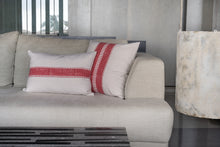 Load image into Gallery viewer, Hand block printed red coloured cotton cushion cover printed on an ivory base fabric placed next to a block printed red coloured cushion cover on a couch