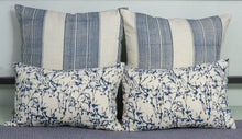 Load image into Gallery viewer, Mood shot of hand blocked blue cushion cover with hand blocked blue lumbar cushion cover on a bed